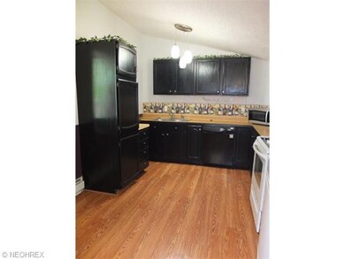 Fully applianced kitchen with pantry.