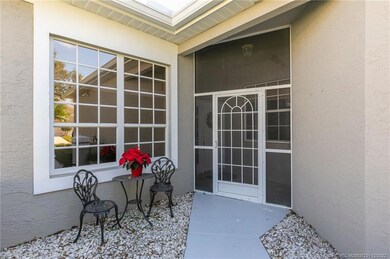 Front walkway to screened in porch entryway.