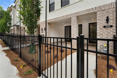 A charming fenced-in front yard welcomes you at the entry to the townhome, offering a private outdoor space. Thoughtfully designed for both curb appeal and function, this cozy front yard creates a warm, inviting 1st impression.