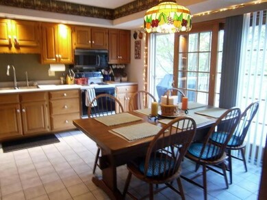 Kitchen dining area opens to the deck