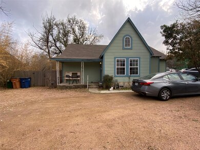 View of front of home with driveway, a shingled r