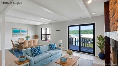 Virtually Staged dining & living room with nice la