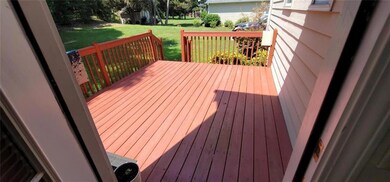 Wooden deck featuring a lawn