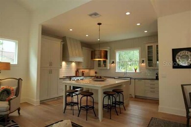 Eating Space in Kitchen - Large island with statuary marble countertop.