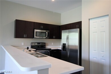 Kitchen with stainless steel appliances, a peninsu