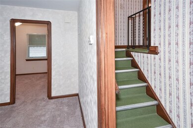 Hallway off living room to upstairs bedrooms & bath