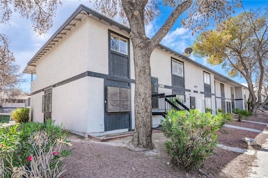 Rear view of property featuring stucco siding