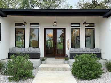 Entrance to property featuring french doors, a po