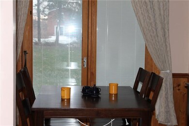 Eat in off of kitchen looks out french doors into 