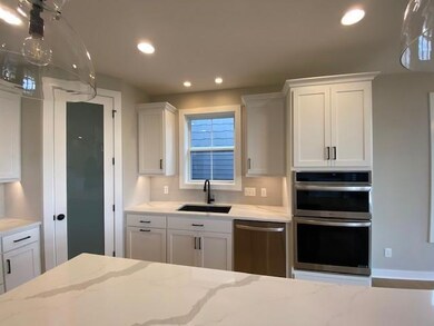 Amazing island perfect for entertaining! And Beautiful quartz countertops!