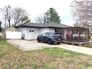 One car garage, gravel extra parking storage build