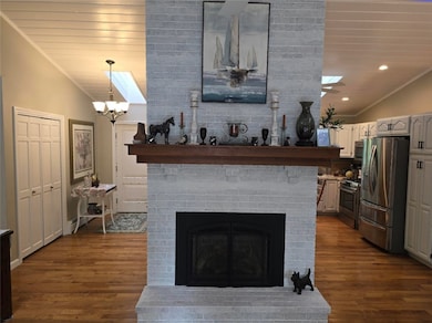 Cathedral Ceiling over central gas fireplace