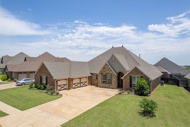 French country style house featuring a garage, brick siding, concrete driveway, and a shingled roof