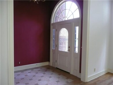 Stately two story Foyer has gleaming marble floori