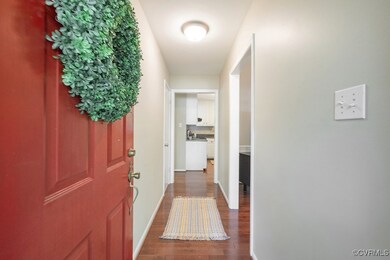 Entrance foyer featuring wood floors.