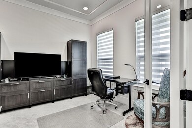 Office with french doors located in the front of the home