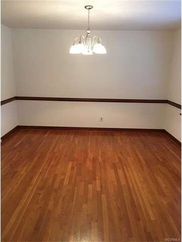 Formal dining room with hardwood floors