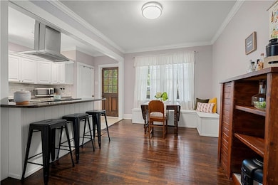 Kitchen with white cabinets, a kitchen breakfast b