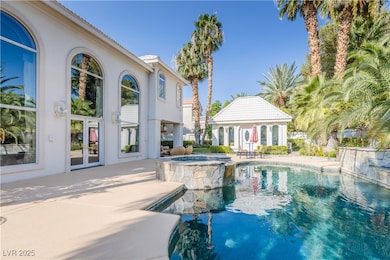 View of pool featuring french doors, a patio area,
