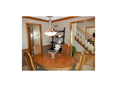 Dining opens to entry hall and hall to kitchen