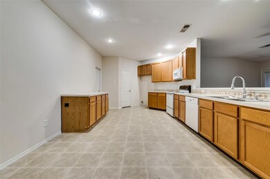 Large kitchen with lots of cabinet & counter-top s