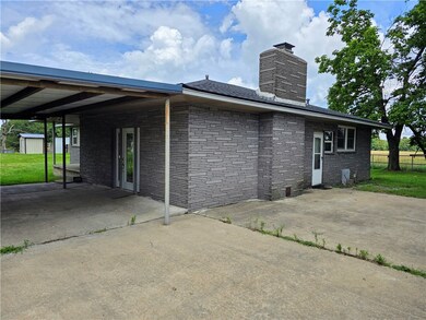 4 car carport & RV parking on pad to the side
