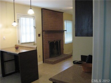 Kitchen - Eating counter with pendant lights and v