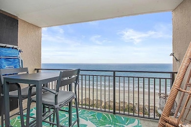 Balcony featuring a water view and a view of the b