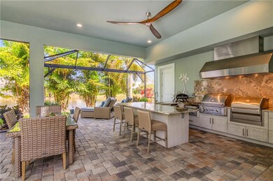 Kitchen featuring light stone countertops, cabinet