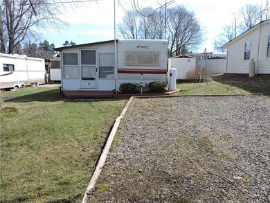 Front Exterior view showing fuller driveway view.