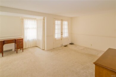 The main living room is very wide and sunny with a
