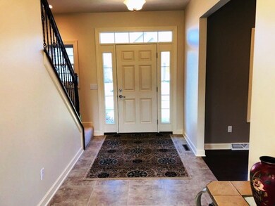 View of front hallway from kitchen dining area.