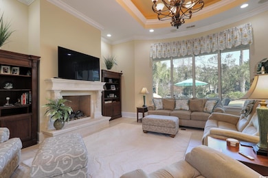 Living room with a premium fireplace, a wealth of 
