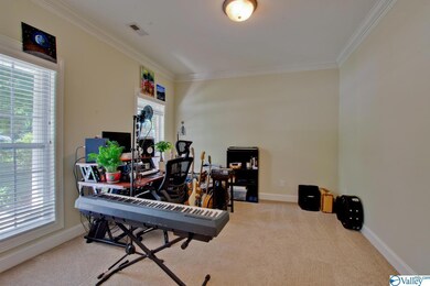 featuring new carpet, fresh paint, and crown molding.