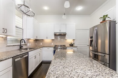 The pot rack above the sink stays with the home so