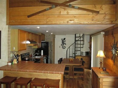 The cedar wall above the kitchen is the front of t