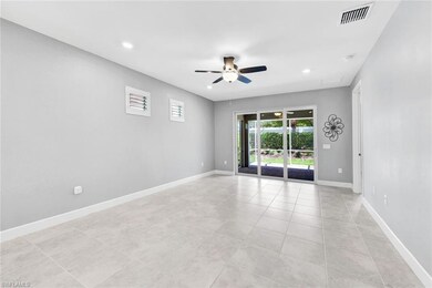 Empty room featuring light tile patterned floors a