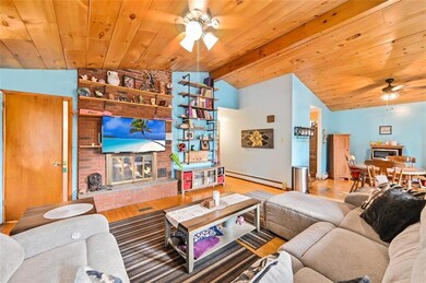 Living Room w/ Brick-Faced Fireplace