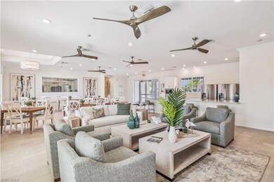 Living room with crown molding and light tile patt