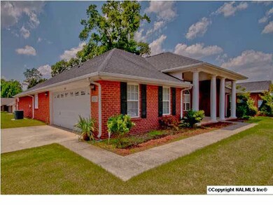 Awesome corner lot with view of 2-car garage.