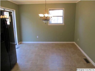 Dinning area with sliding glass door opening to de