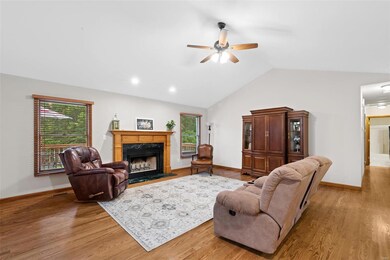The great room has a fireplace to keep it cozy fla