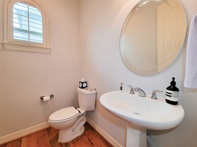 Second floor powder room with pedestal sink.