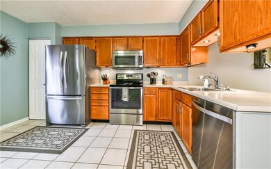 Kitchen features plenty of cabinets, pantry, ceram