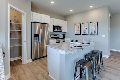 One last look at the kitchen space. Just an awesome use of space!!! (Photo of model, colors are similar)