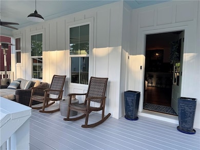 Wooden deck featuring a ceiling fan