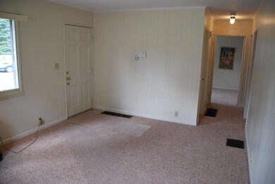 Living Room: new neutral carpet, storm door w/ screen & lots of natural light. Access to the kitchen, full bathroom and all 3 bedrooms.