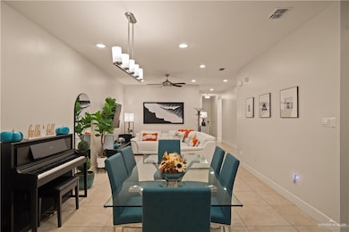 Dining space with light tile patterned floors, recessed lighting, and ceiling fan