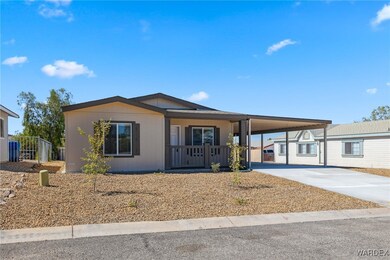 View of front of property featuring a carport