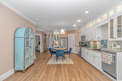 Kitchen with stainless steel appliances, baseboard